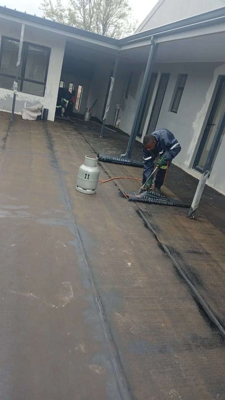 Torch-on waterproofing membrane being applied